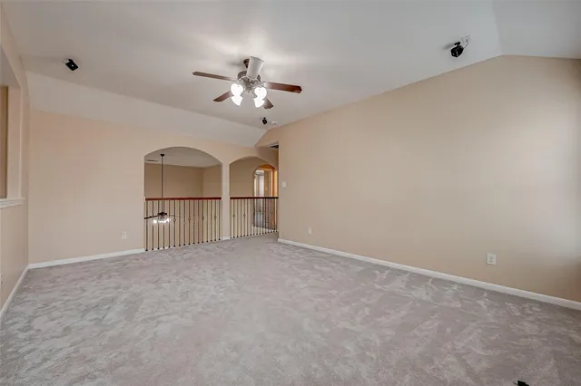 a view of empty room with fan