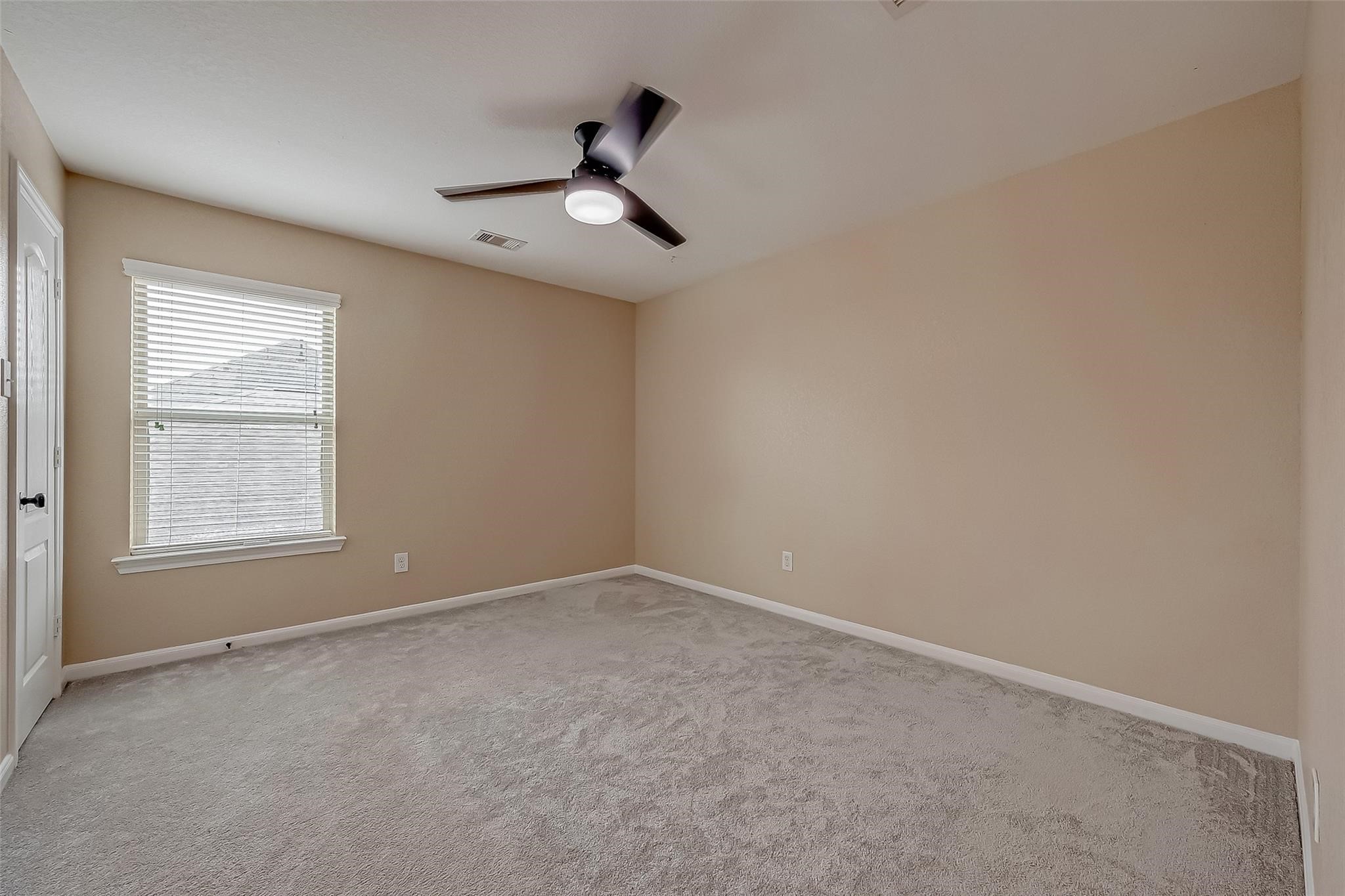 21831 Mount Hunt Drive Spring, TX 77388 - Photo 38 of 47 an empty room with a window