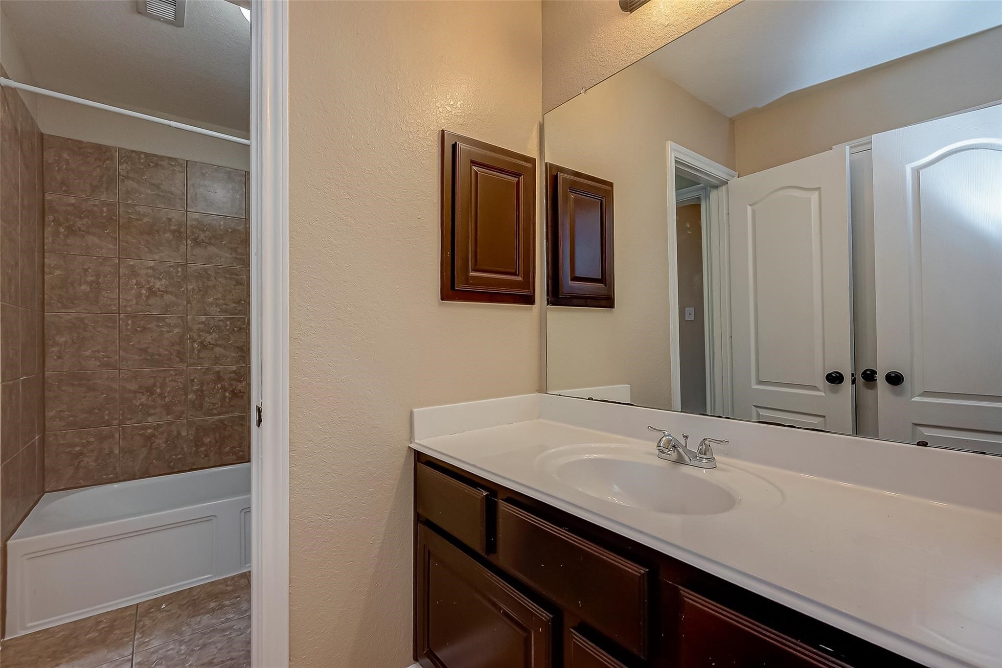 21831 Mount Hunt Drive Spring, TX 77388 - Photo 42 of 47 a bathroom with a sink and a mirror