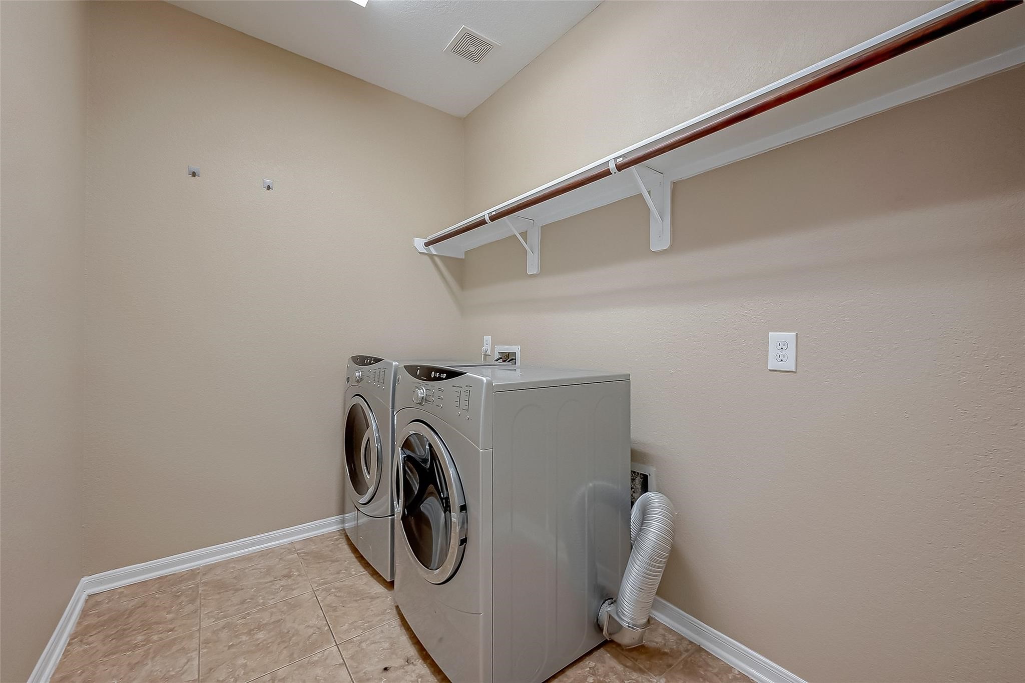 21831 Mount Hunt Drive Spring, TX 77388 - Photo 47 of 47 a utility room with dryer and washer