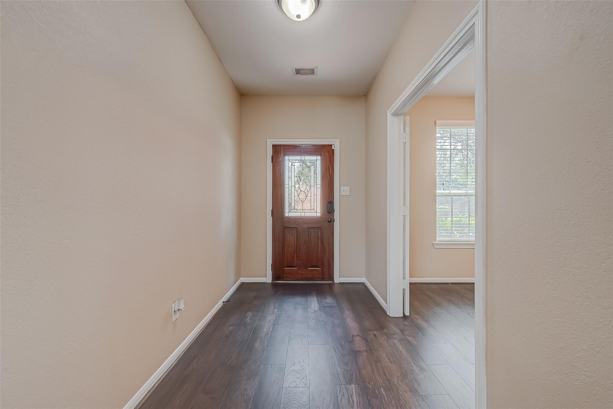 21831 Mount Hunt Drive Spring, TX 77388 - Photo 5 of 47 an empty room with wooden floor and windows