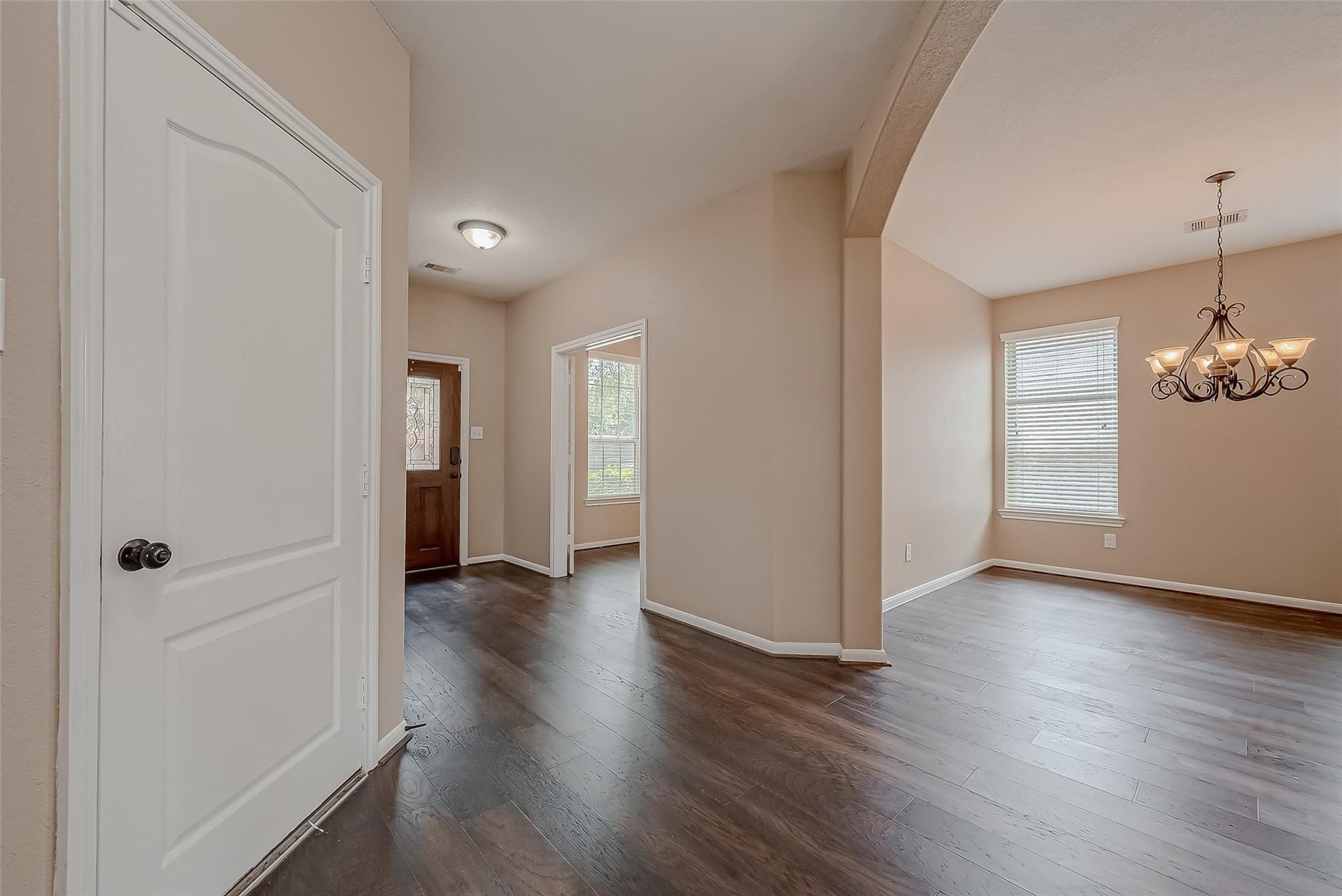 21831 Mount Hunt Drive Spring, TX 77388 - Photo 8 of 47 wooden floor in an empty room with a window