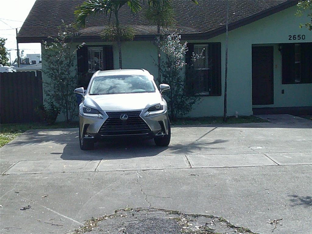 a view of a patio with table and chairs and potted plants