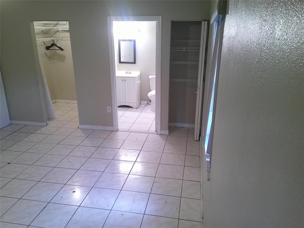 Undisclosed Address Opa-Locka, FL 33054 - Photo 6 of 9 a view of a bathroom with a sink and a toilet