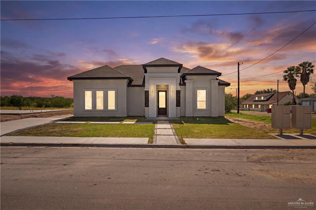 801 Falcon Street Rio Grande City, TX 78582 - Photo 1 of 36 a front view of a house with a yard