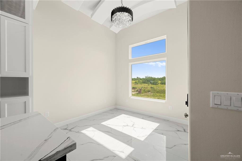 801 Falcon Street Rio Grande City, TX 78582 - Photo 11 of 36 a view of an empty room with a window