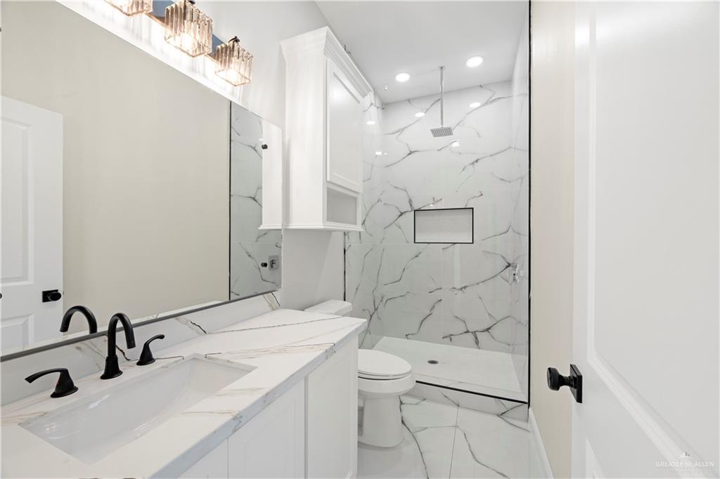 801 Falcon Street Rio Grande City, TX 78582 - Photo 17 of 36 a bathroom with a sink toilet and shower