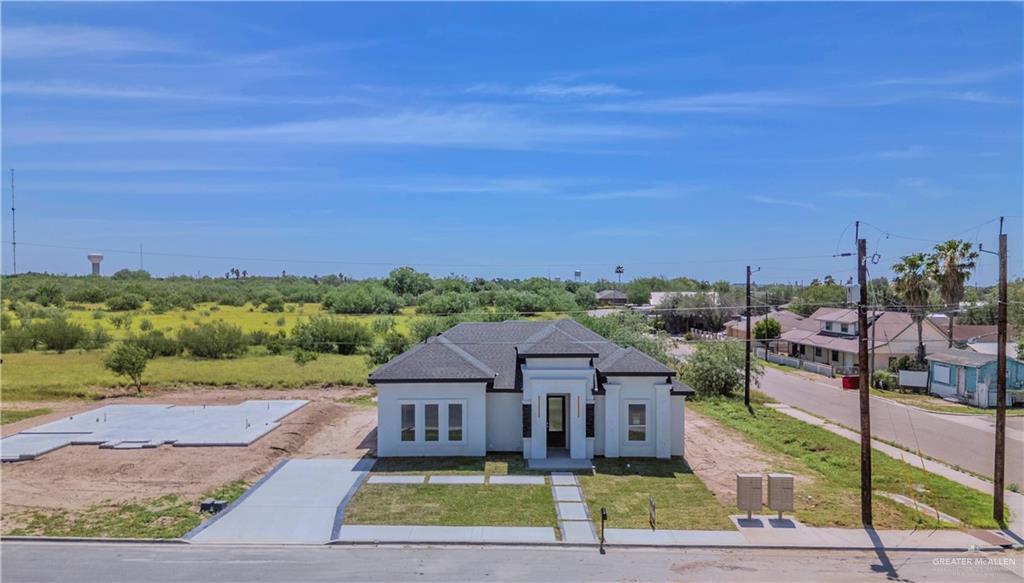 801 Falcon Street Rio Grande City, TX 78582 - Photo 25 of 36 a view of a big house with a big yard