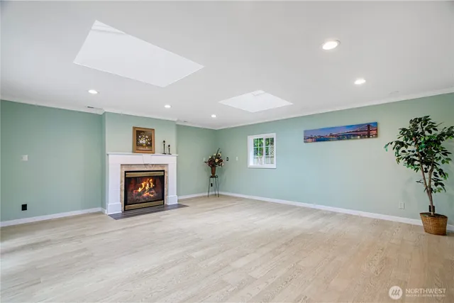 a view of an empty room with a fireplace