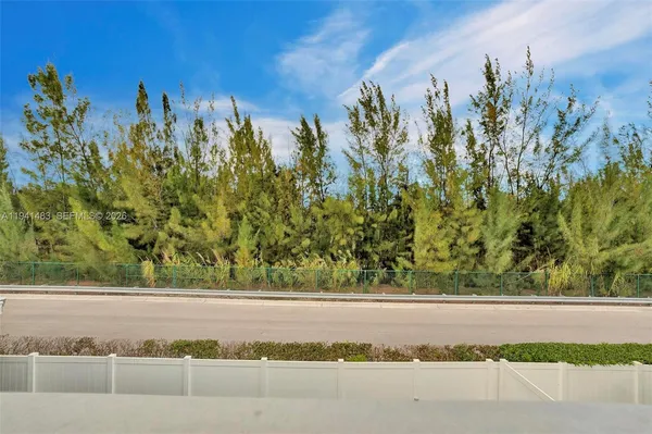 a view of an chairs and table in patio