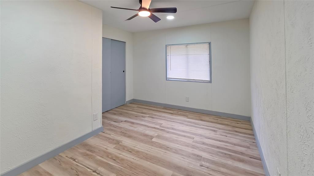 111 Custer Mabank, TX 75156 - Photo 12 of 20 a view of empty room with wooden floor