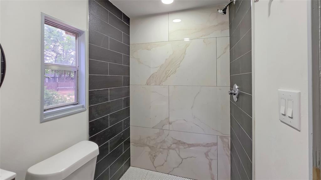111 Custer Mabank, TX 75156 - Photo 13 of 20 a bathroom with a toilet and a shower