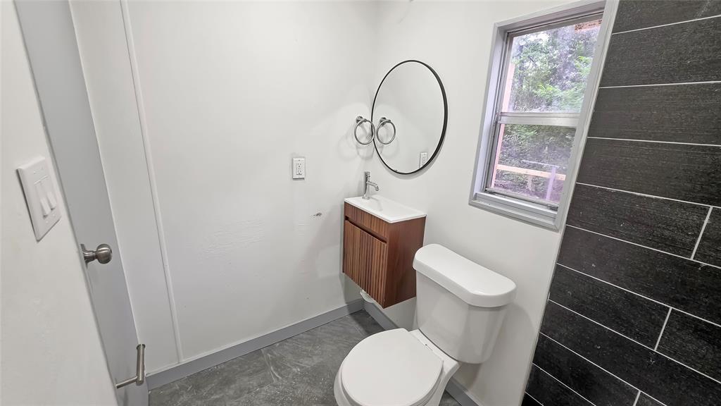 111 Custer Mabank, TX 75156 - Photo 14 of 20 a white toilet sitting next to a small bathroom
