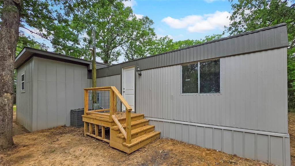 111 Custer Mabank, TX 75156 - Photo 18 of 20 a house view with a backyard space