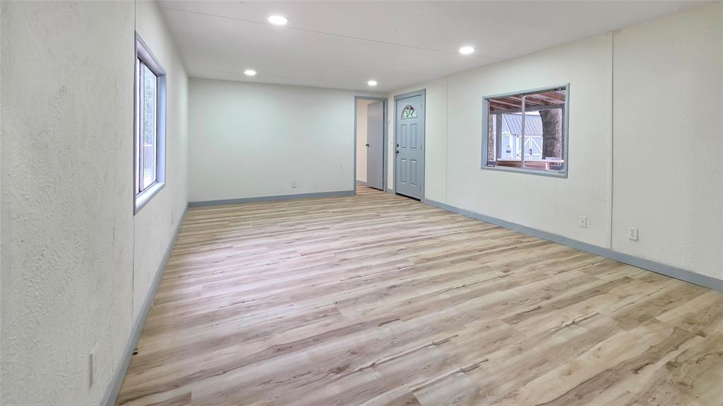 111 Custer Mabank, TX 75156 - Photo 2 of 20 a view of empty room with wooden floor