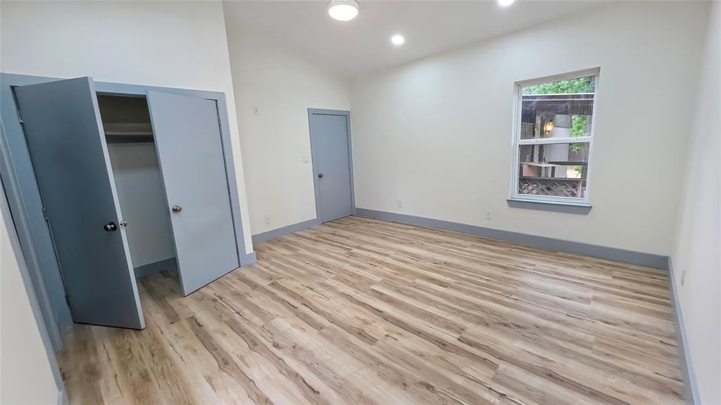 111 Custer Mabank, TX 75156 - Photo 7 of 20 an empty room with closet and wooden floor