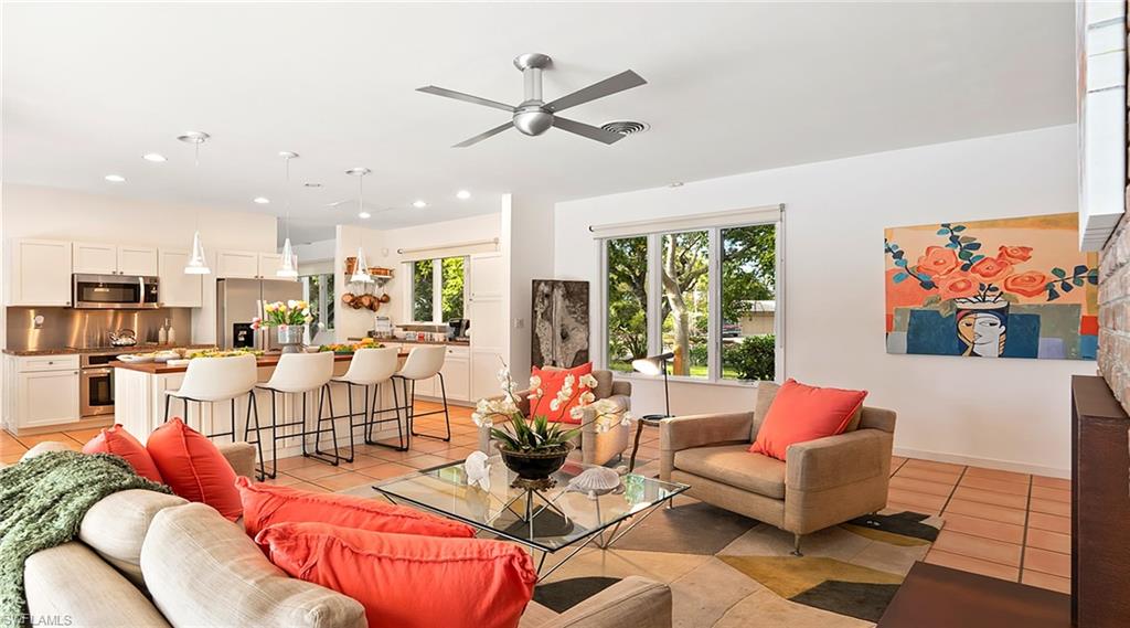 586 Yucca Road Naples, FL 34102 - Photo 6 of 26 Living room featuring light tile patterned floors, a ceiling fan, and recessed lighting