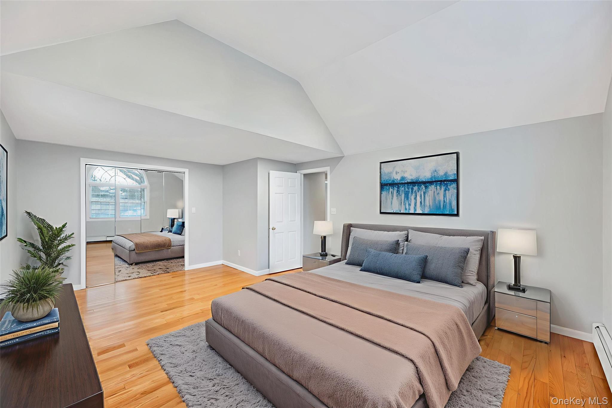 2585 Oceanside Road Oceanside, NY 11572 - Photo 12 of 30 a bedroom with a large bed and a couch