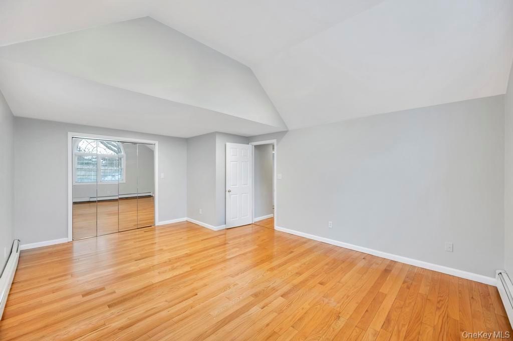 2585 Oceanside Road Oceanside, NY 11572 - Photo 13 of 30 a view of empty room with wooden floor and fan