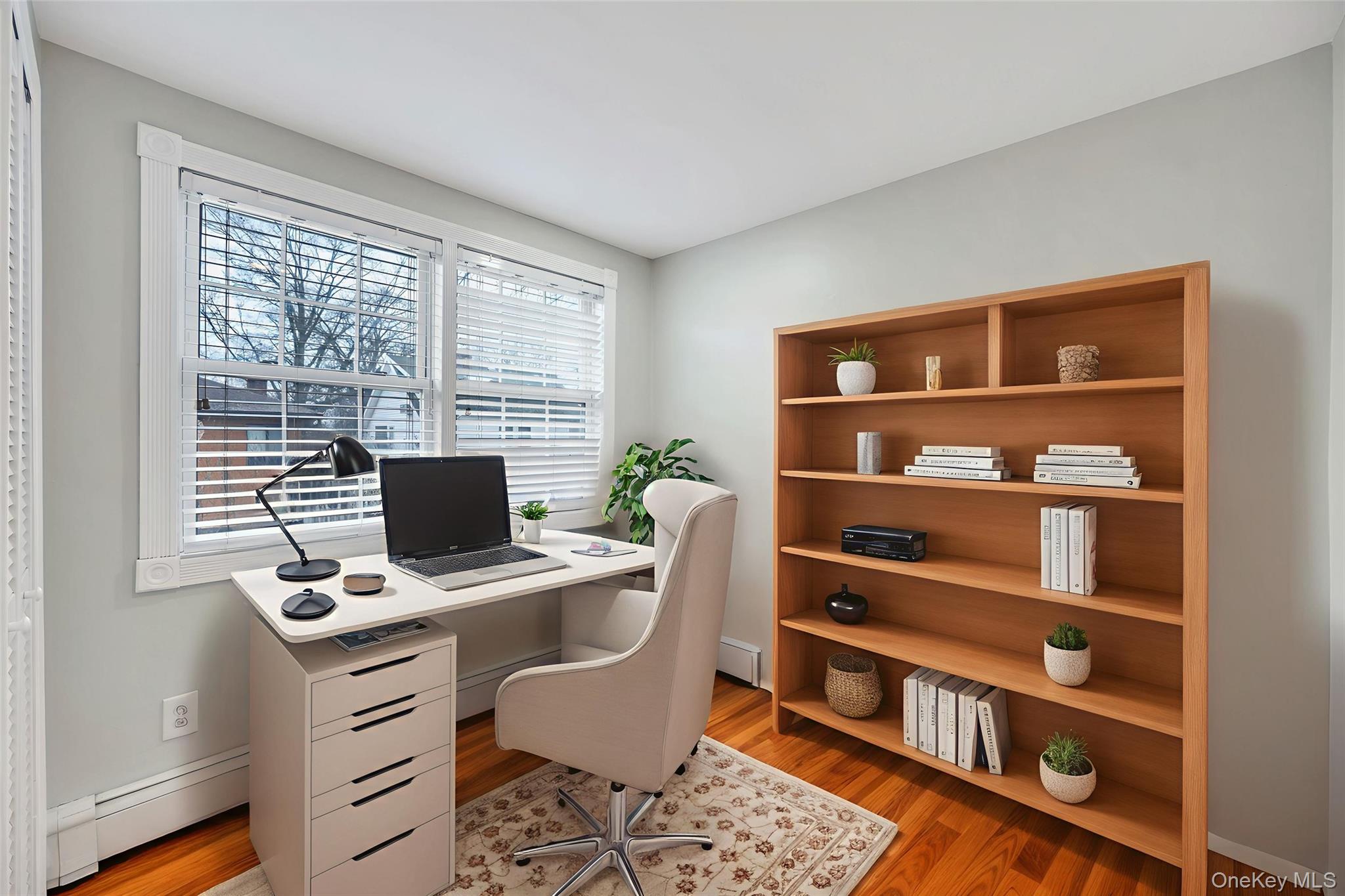 2585 Oceanside Road Oceanside, NY 11572 - Photo 14 of 30 a view of a workspace with furniture and a window