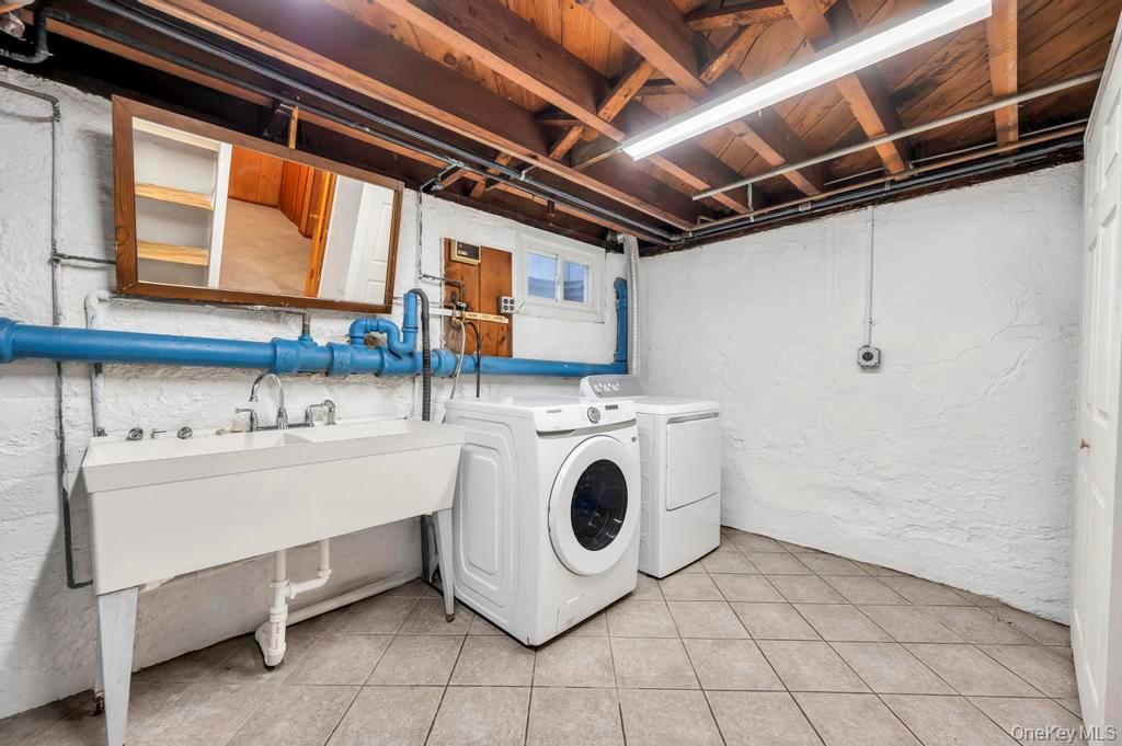 2585 Oceanside Road Oceanside, NY 11572 - Photo 21 of 30 a utility room with dryer and washer