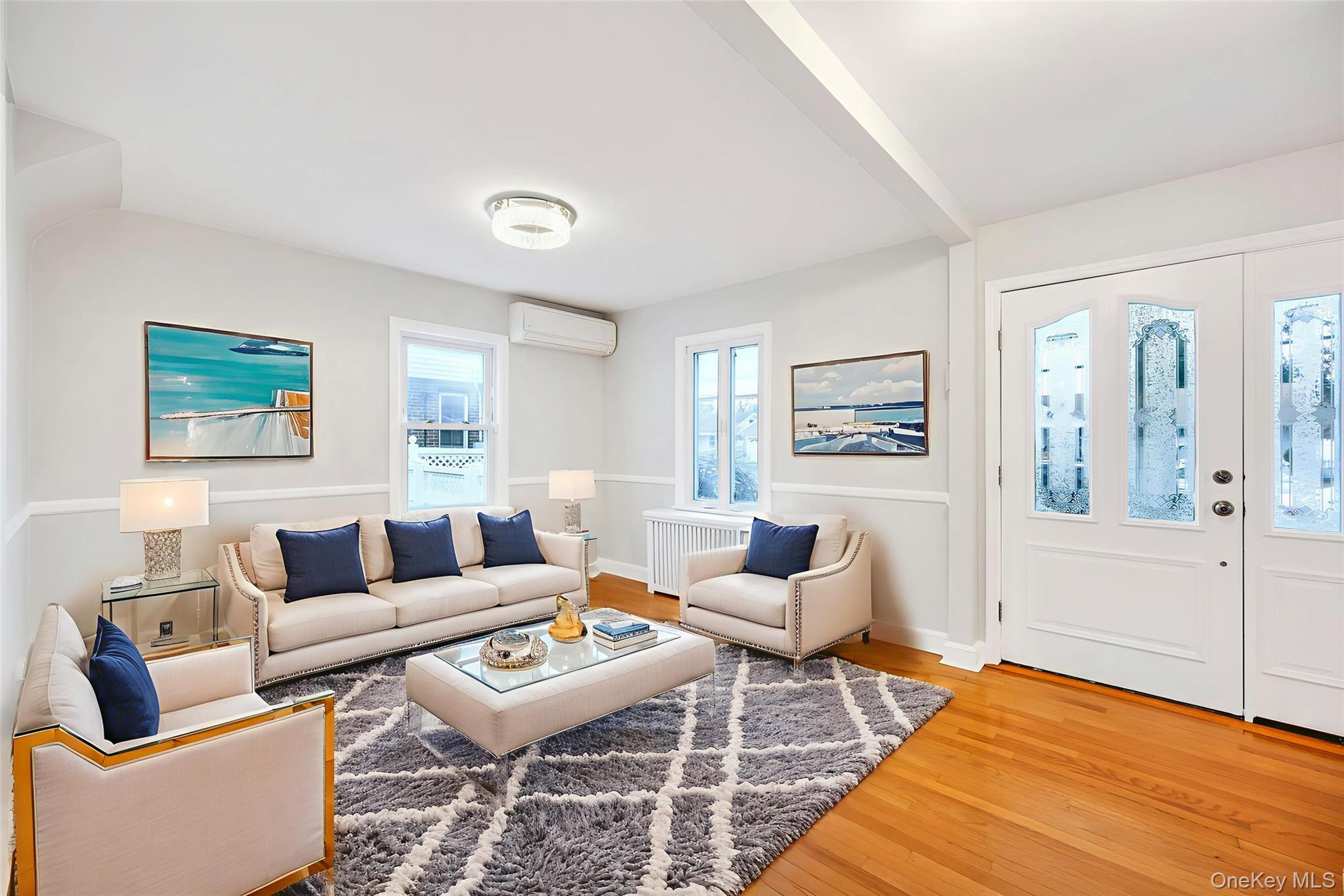 2585 Oceanside Road Oceanside, NY 11572 - Photo 4 of 30 a living room with furniture and wooden floor