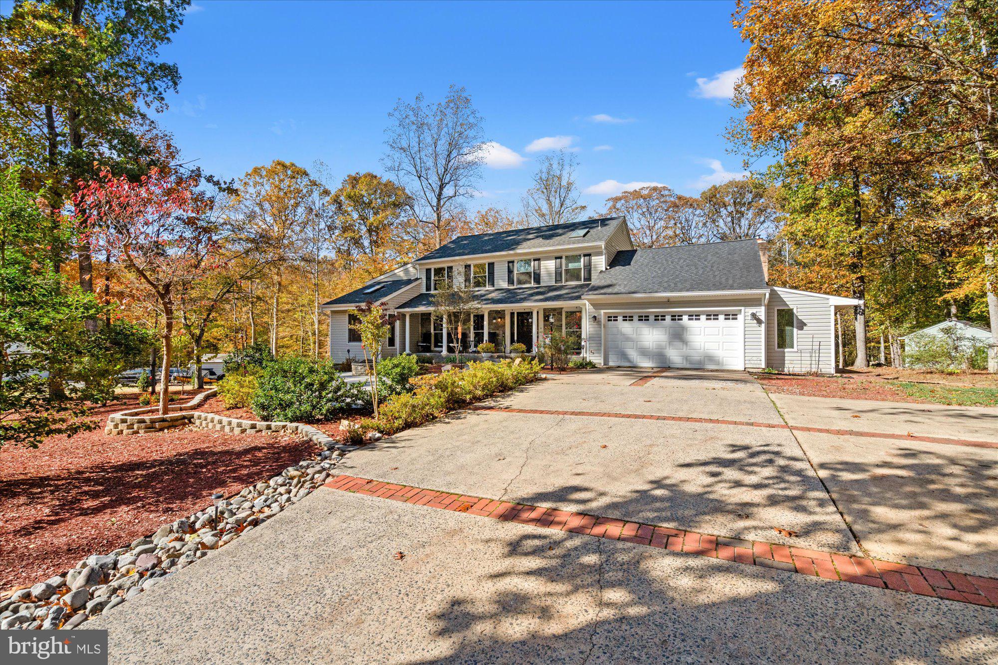 14520 Idlebrook Court Manassas, VA 20112 - Photo 28 of 87 a front view of a house with a yard