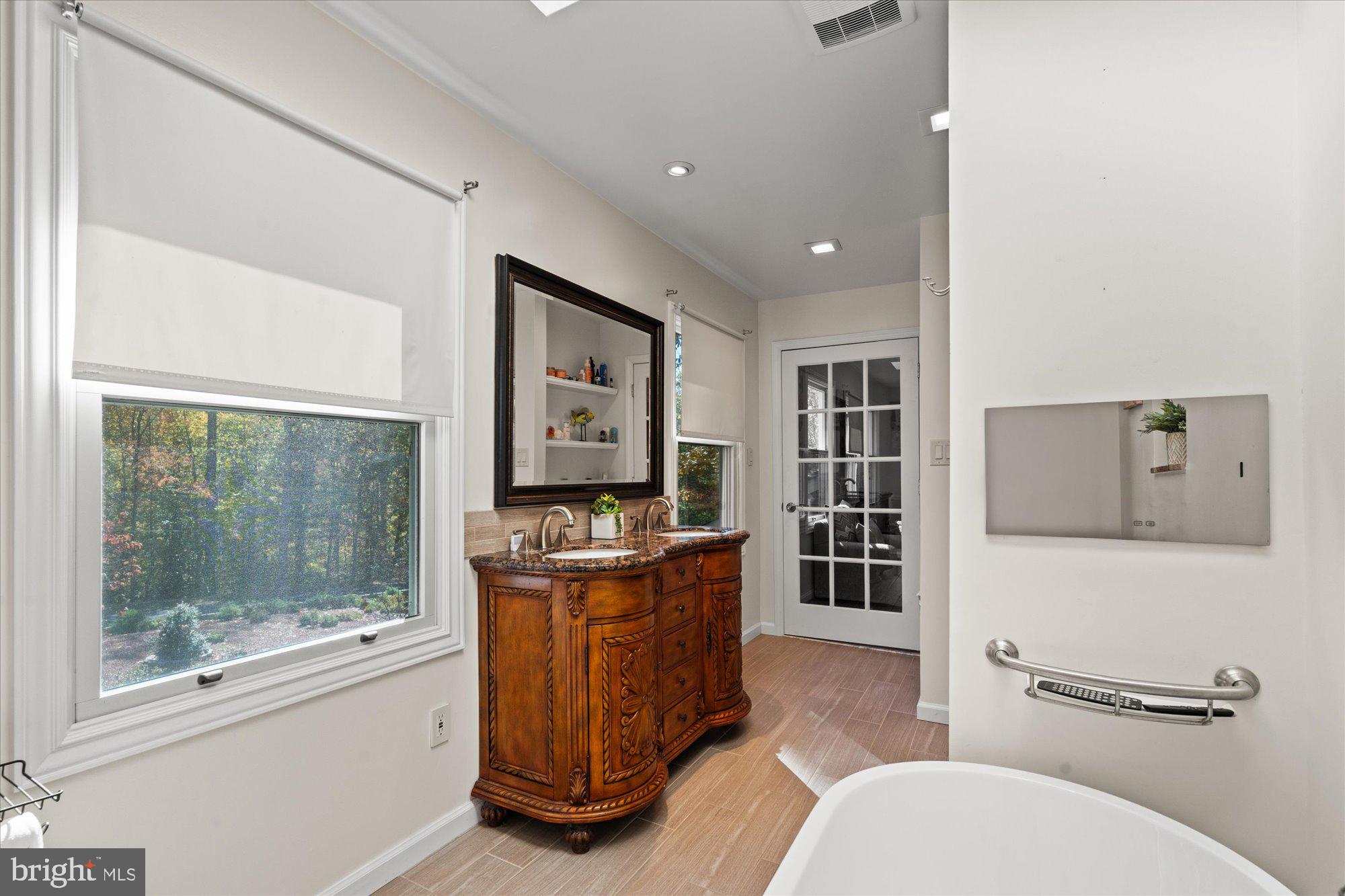 14520 Idlebrook Court Manassas, VA 20112 - Photo 41 of 87 a living room with furniture a window and a flat screen tv