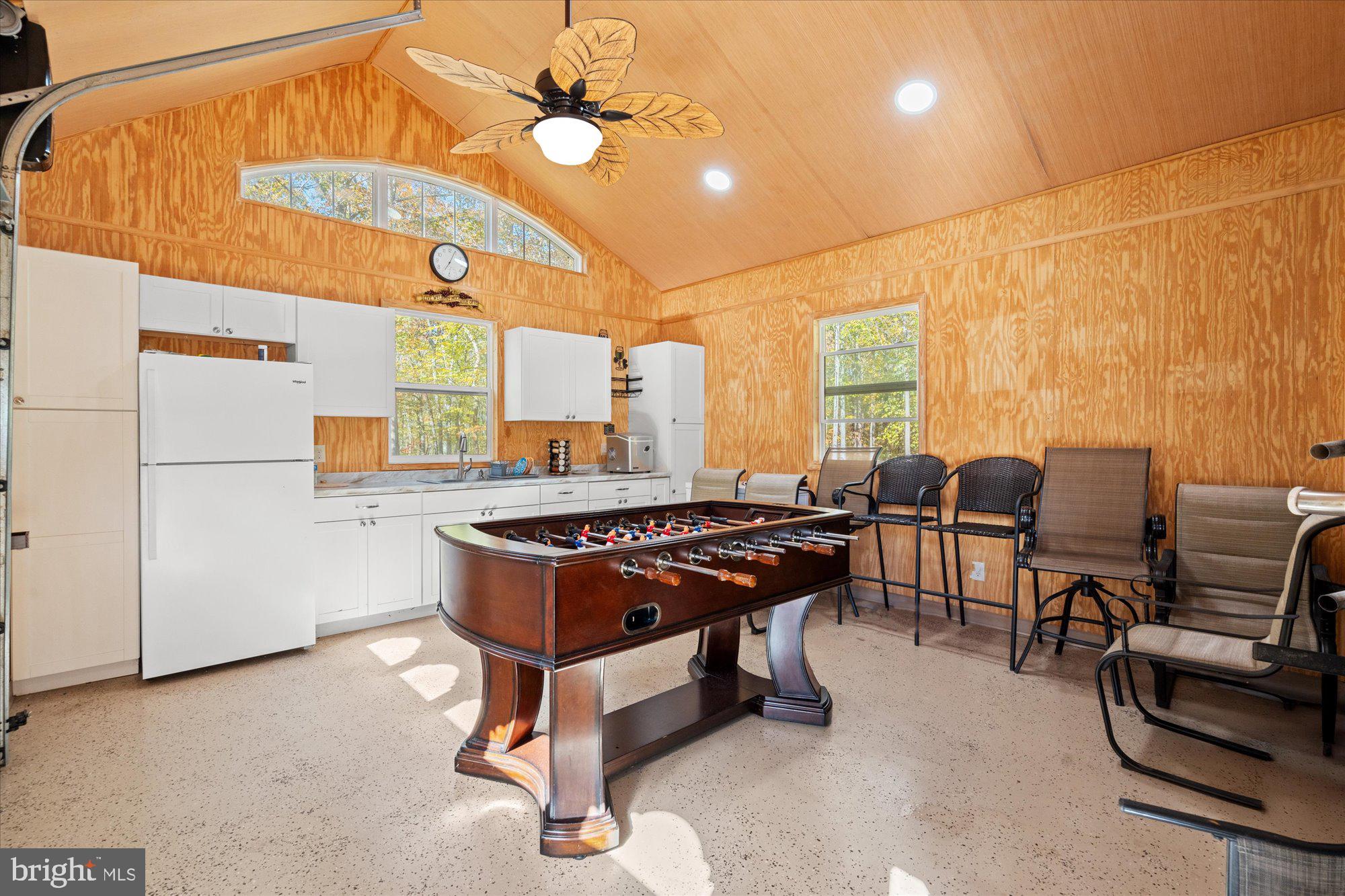 14520 Idlebrook Court Manassas, VA 20112 - Photo 44 of 87 a living room with a table chairs and a dining table with wooden floor