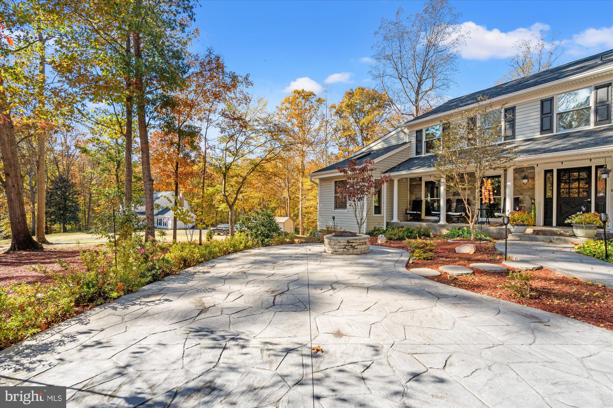 14520 Idlebrook Court Manassas, VA 20112 - Photo 45 of 87 a front view of a house with basket ball court and outdoor seating