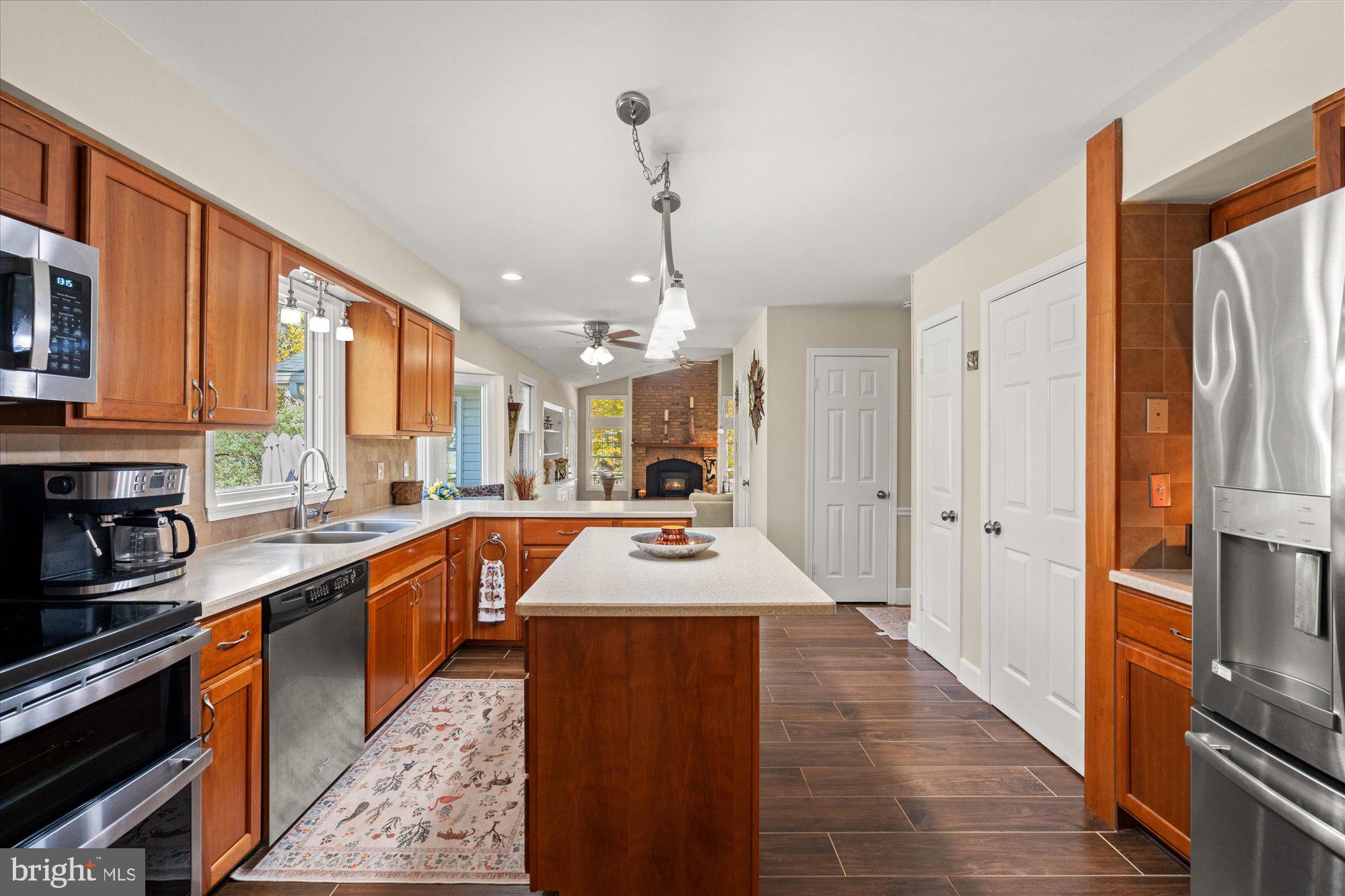 14520 Idlebrook Court Manassas, VA 20112 - Photo 60 of 87 a kitchen with stainless steel appliances granite countertop a sink stove and refrigerator