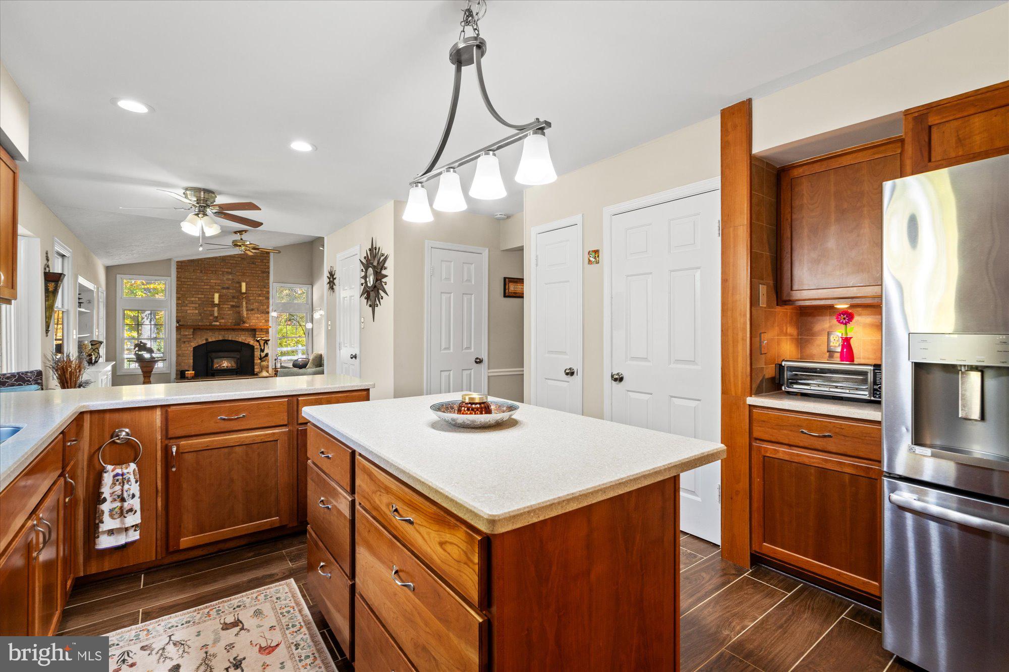 14520 Idlebrook Court Manassas, VA 20112 - Photo 65 of 87 a kitchen with a sink a counter top space stainless steel appliances a large window and cabinets
