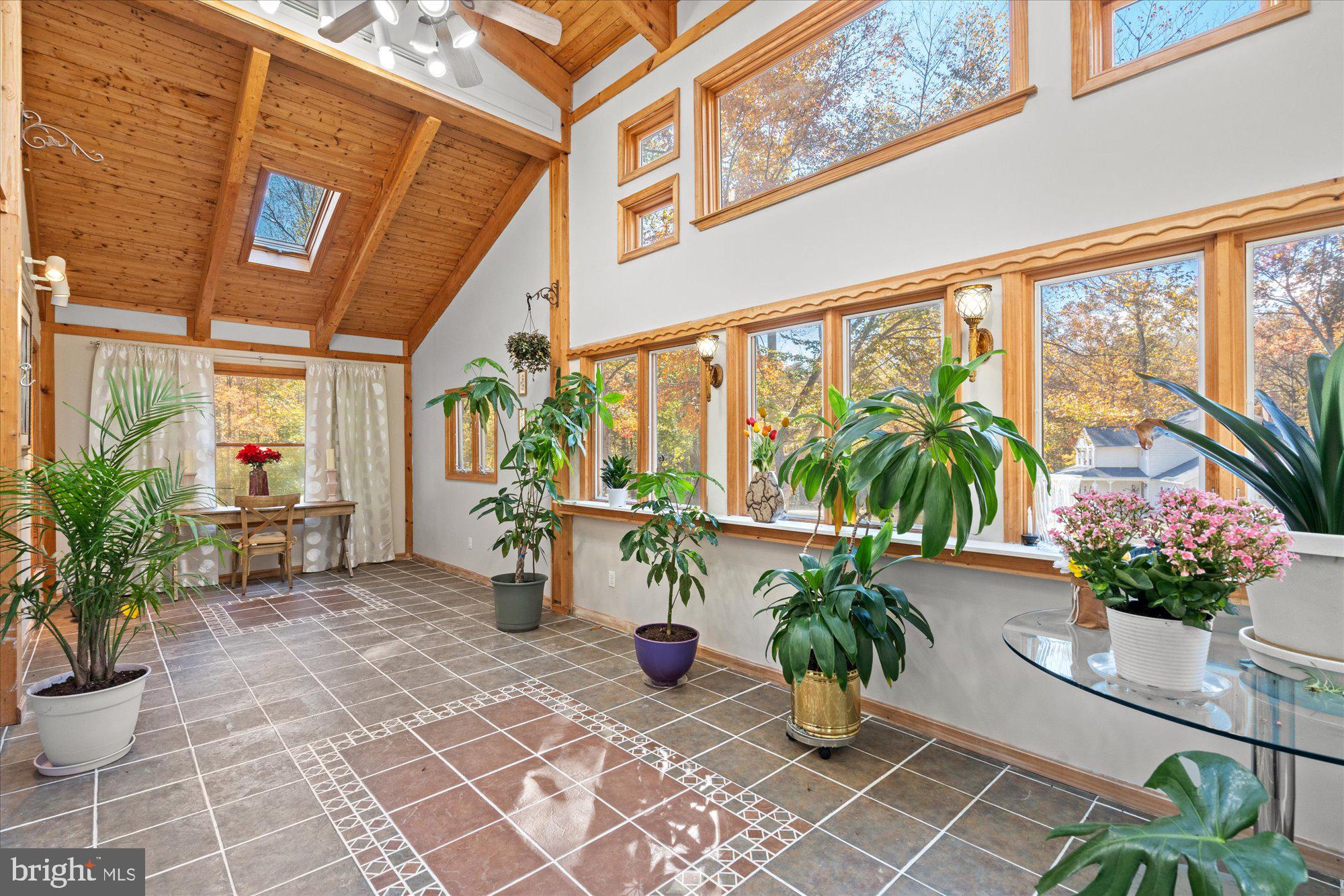 14520 Idlebrook Court Manassas, VA 20112 - Photo 72 of 87 a view of a chairs and table in the patio with potted plants