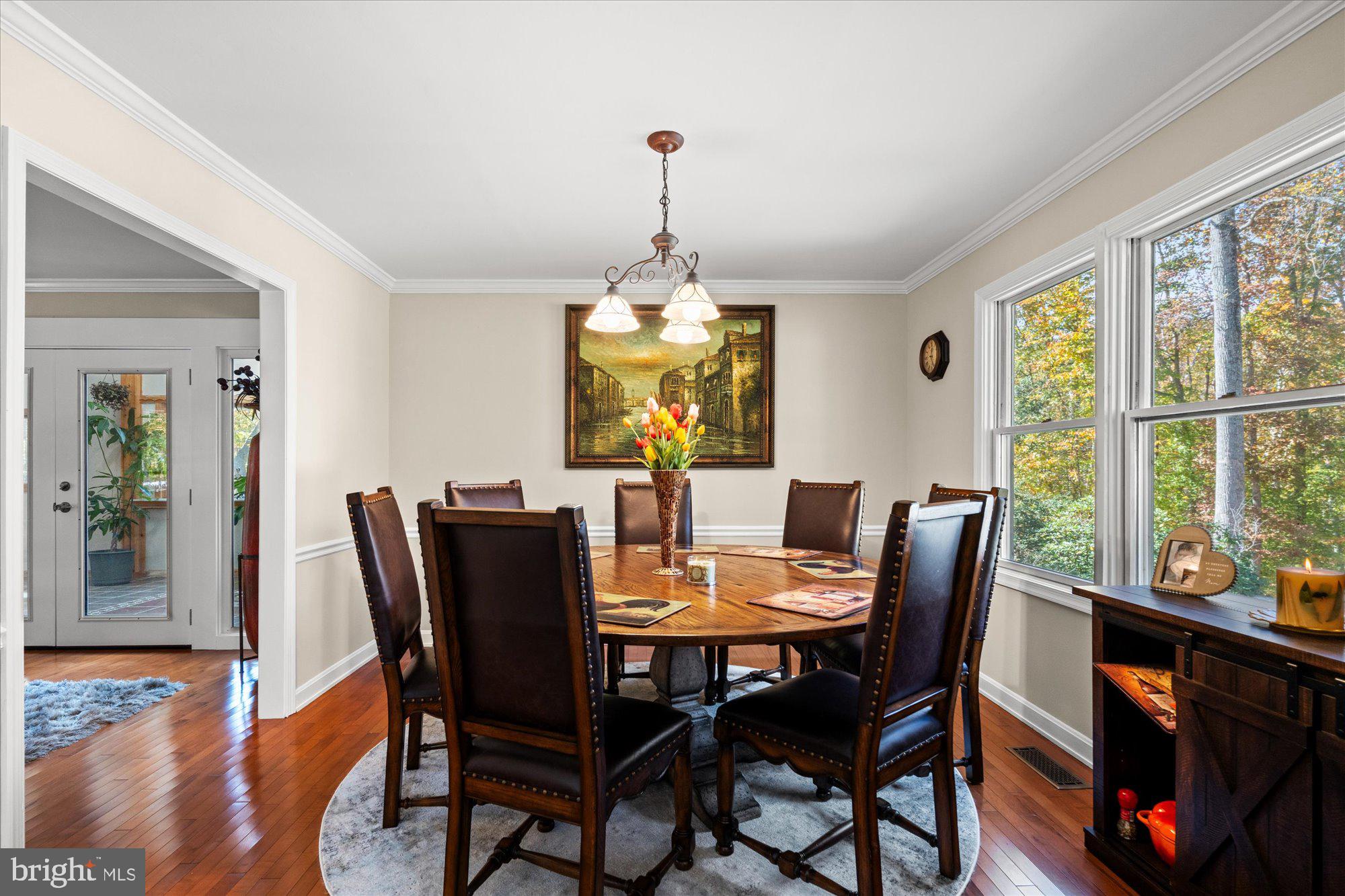 14520 Idlebrook Court Manassas, VA 20112 - Photo 73 of 87 a dining room with furniture window and wooden floor