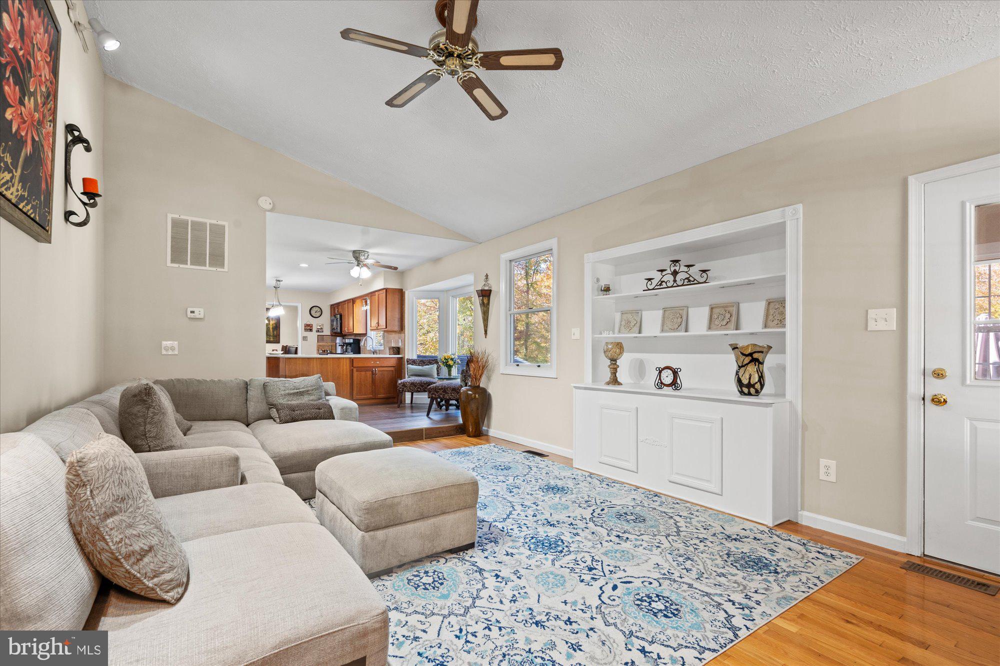 14520 Idlebrook Court Manassas, VA 20112 - Photo 75 of 87 a living room with furniture and a rug
