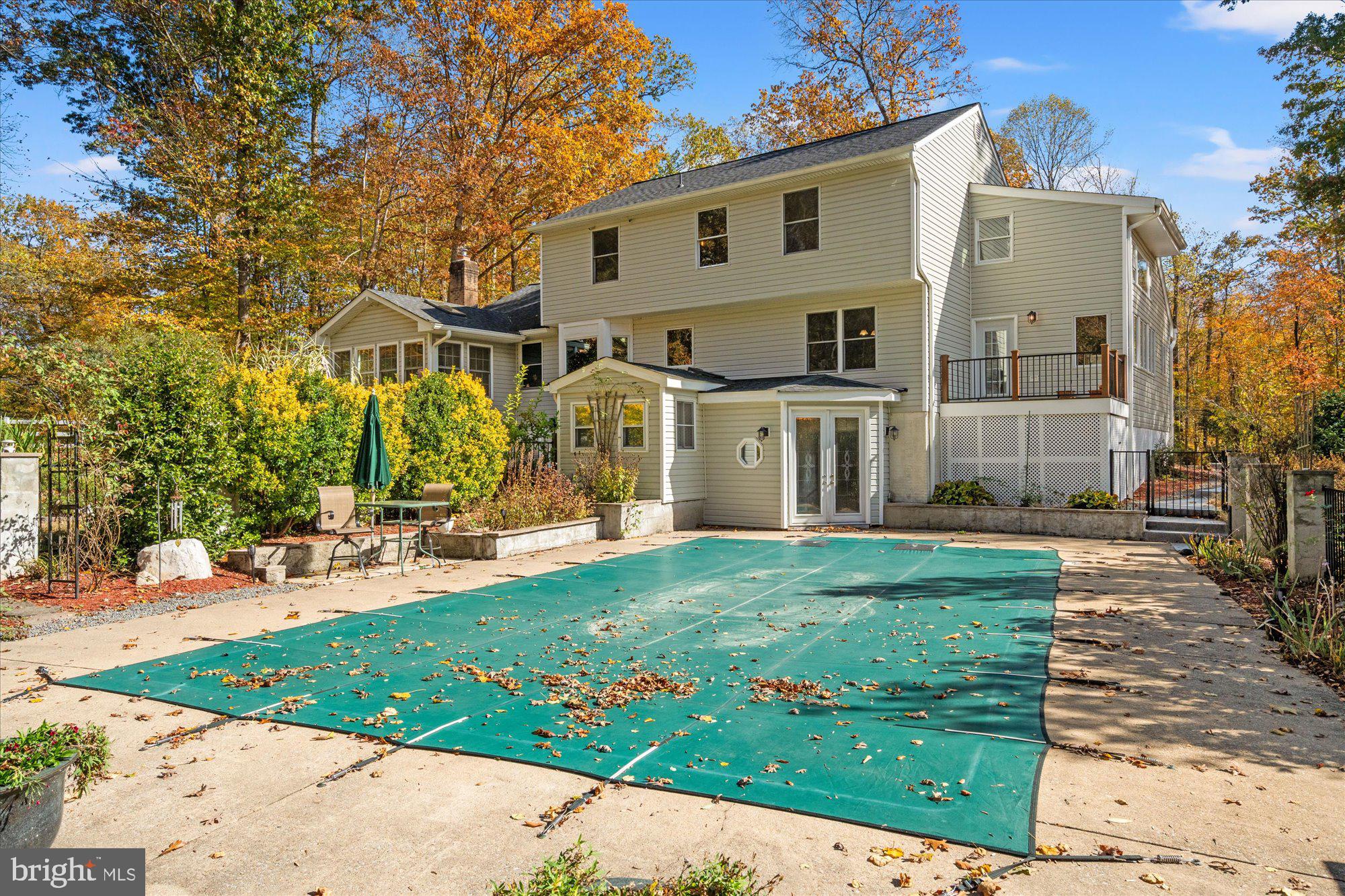 14520 Idlebrook Court Manassas, VA 20112 - Photo 85 of 87 a view of a white house with a big yard and large trees
