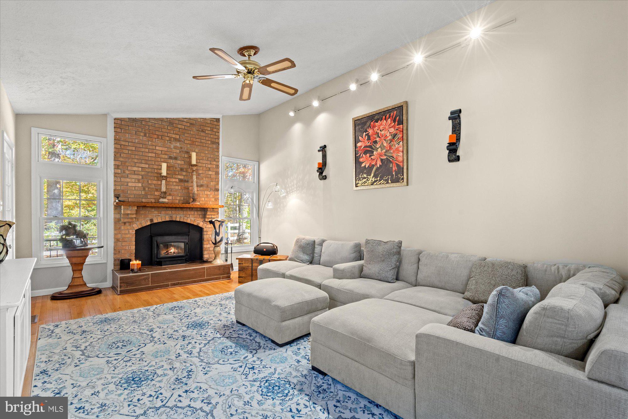 14520 Idlebrook Court Manassas, VA 20112 - Photo 86 of 87 a living room with furniture and a fireplace