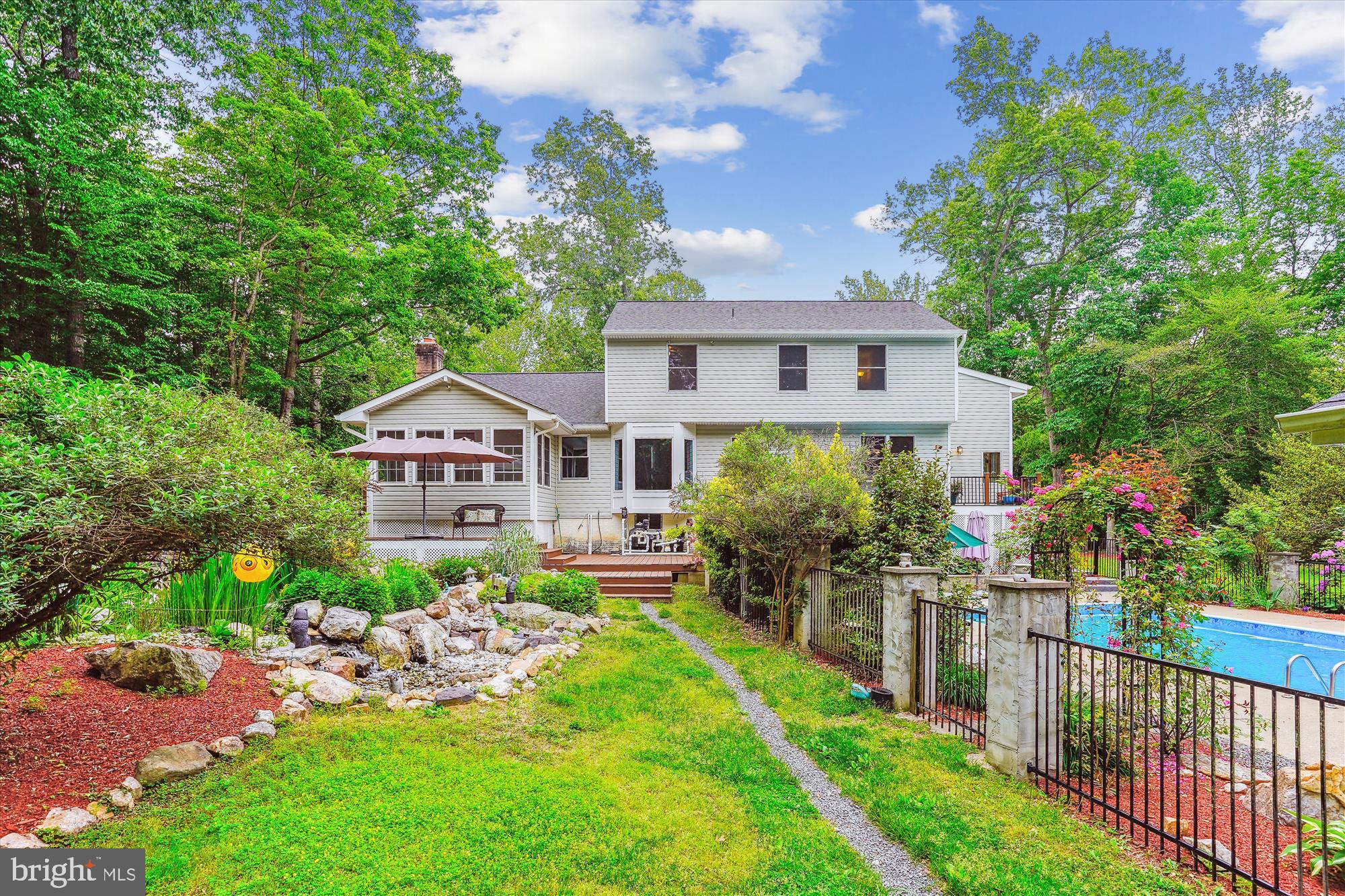 14520 Idlebrook Court Manassas, VA 20112 - Photo 9 of 87 a front view of a house with yard and green space