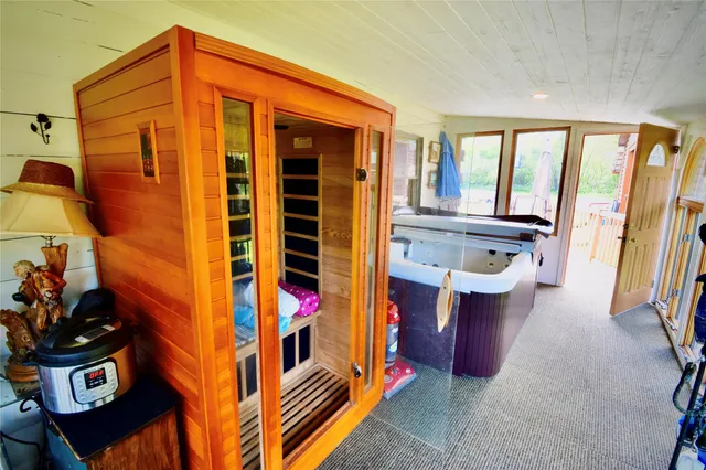 a dining room with furniture and a kitchen view
