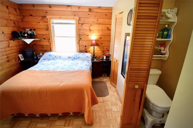 a living room with fireplace furniture and a large window