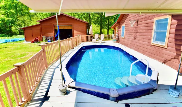 a view of a big yard with lots of bushes