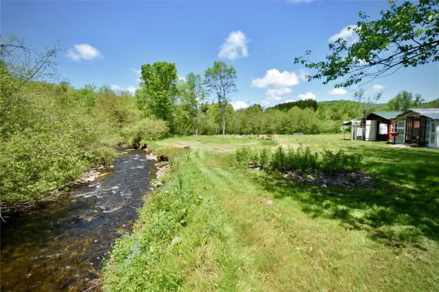 a balcony with table and chairs
