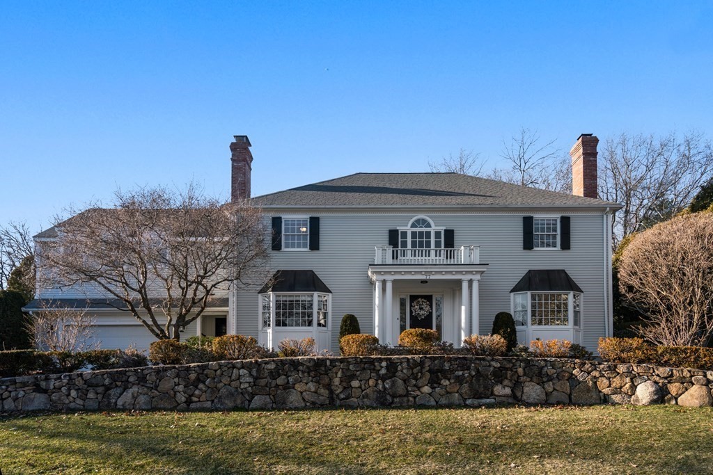 77 Monadnock Road Wellesley, MA 02481 - Photo 1 of 39 a front view of a house with garden