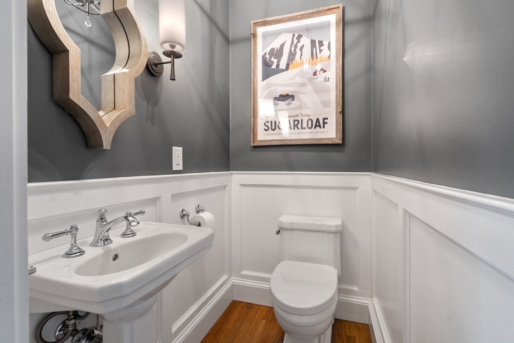 77 Monadnock Road Wellesley, MA 02481 - Photo 14 of 39 a bathroom with a toilet sink and mirror