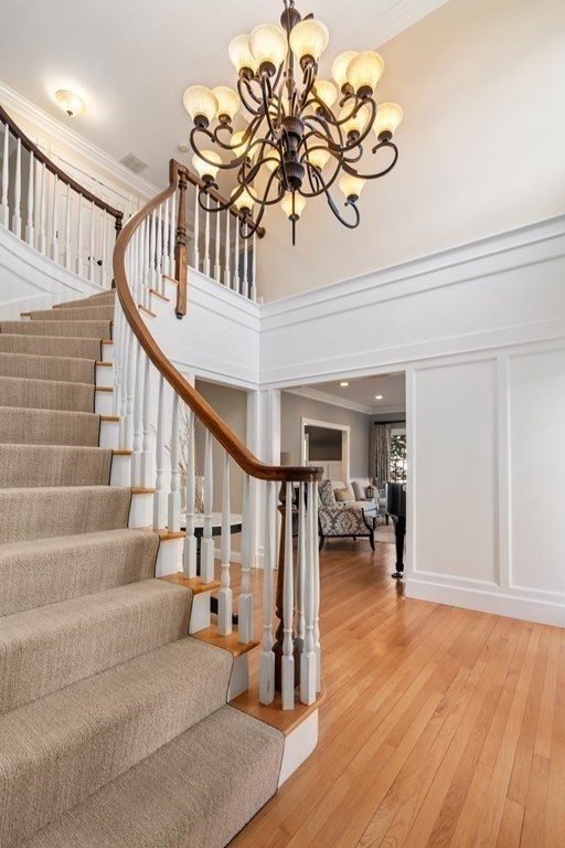 77 Monadnock Road Wellesley, MA 02481 - Photo 16 of 39 a view of entryway and hall with wooden floor