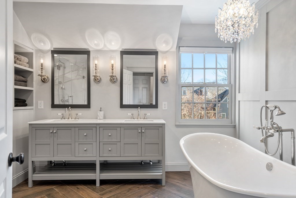 77 Monadnock Road Wellesley, MA 02481 - Photo 20 of 39 a spacious bathroom with double vanity sinks a mirror and a bathtub