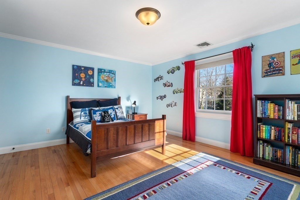 77 Monadnock Road Wellesley, MA 02481 - Photo 28 of 39 a bedroom with furniture and a book shelf