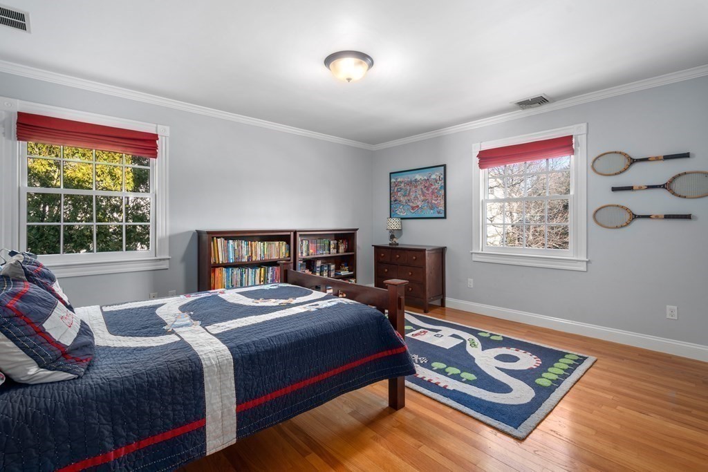 77 Monadnock Road Wellesley, MA 02481 - Photo 29 of 39 a bedroom with a bed and a window
