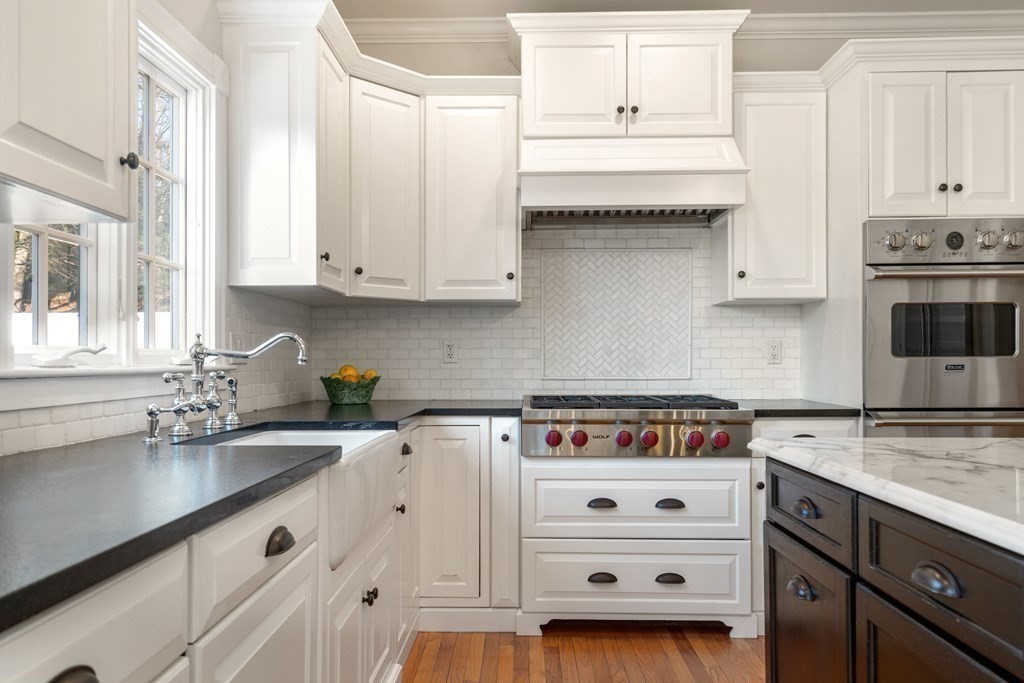 77 Monadnock Road Wellesley, MA 02481 - Photo 6 of 39 a kitchen with cabinets appliances a sink and a counter