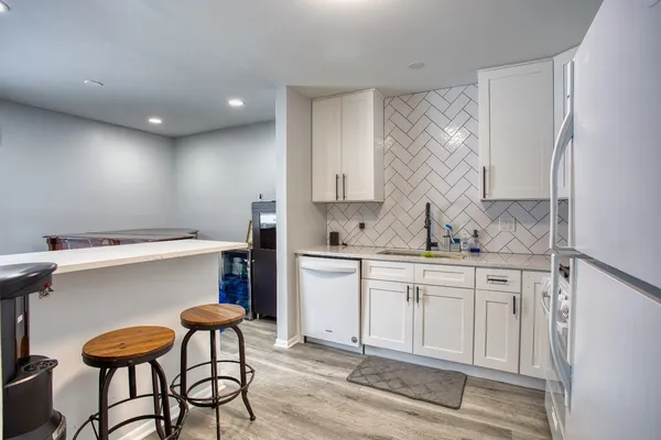a kitchen with a sink cabinets and window